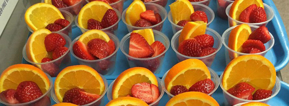 Strawberry and orange cups for school lunches.